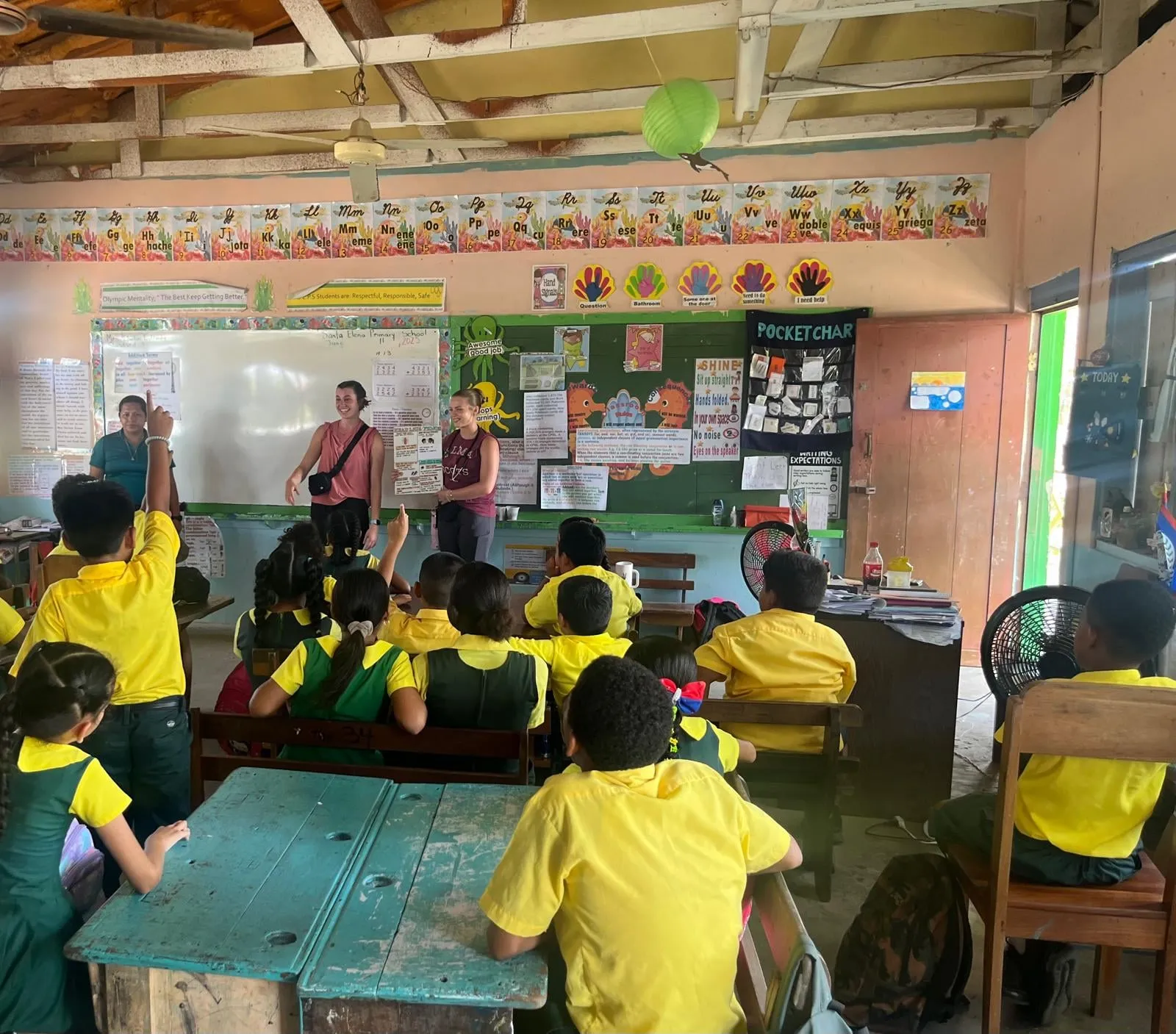 Students leading a health lesson for schoolchildren in Belize