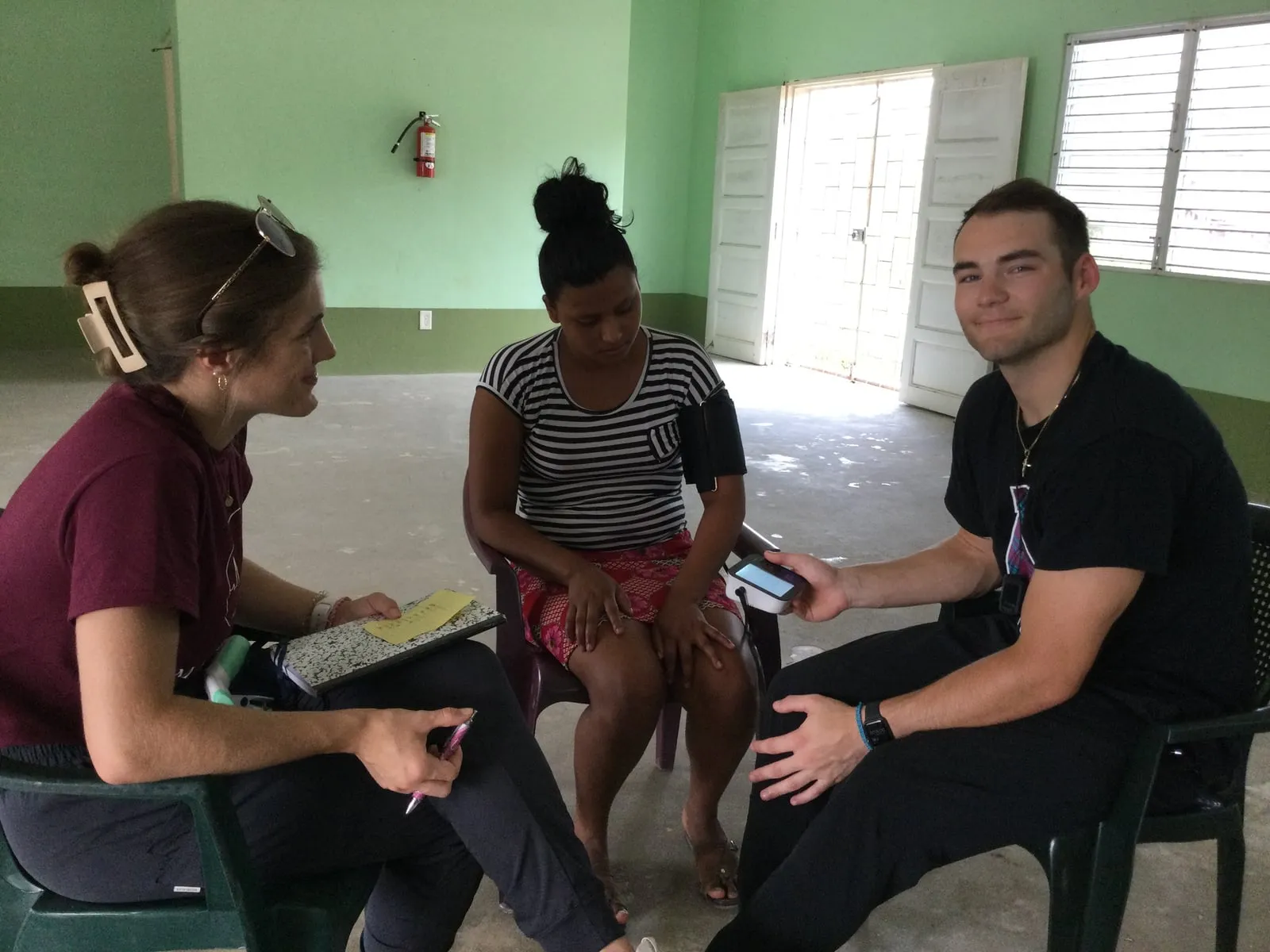 Nursing students working with a patient at a clinic in Belize