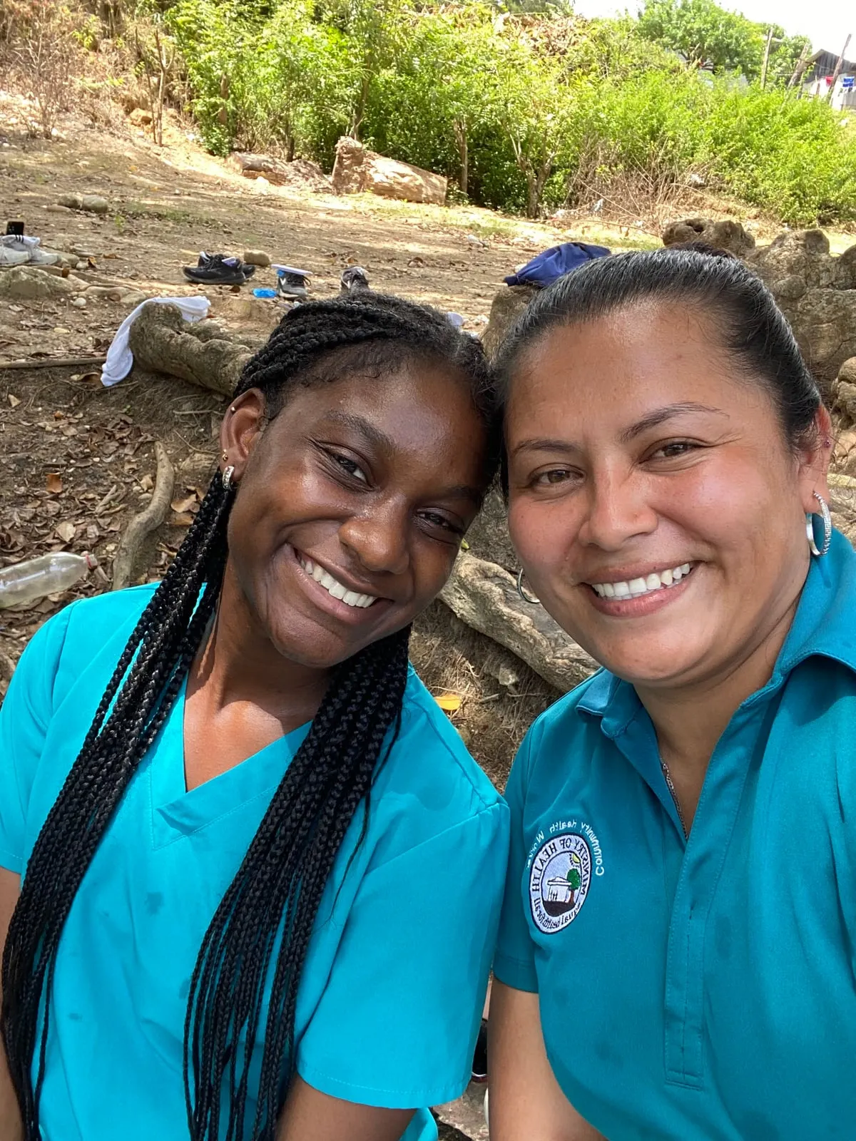 Student with a Belizean community health worker