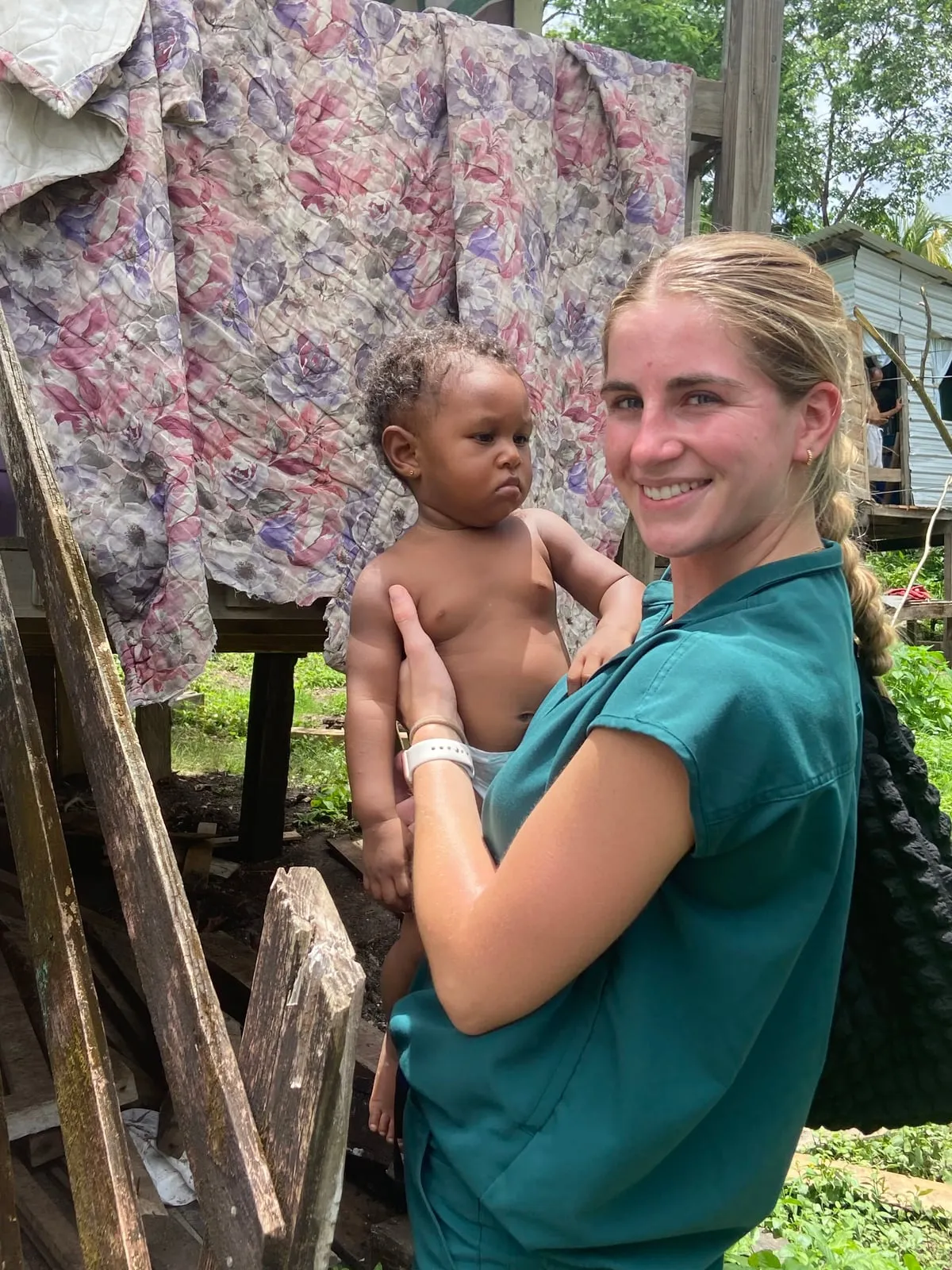 Nursing student with a toddler in a Belizean village