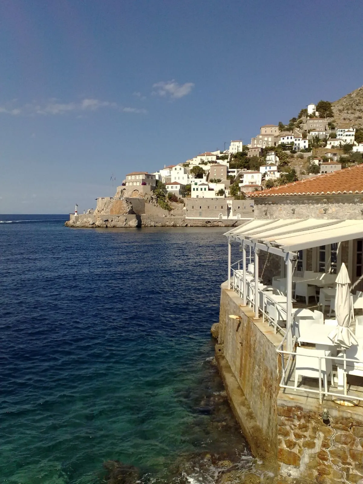 Whitewashed houses above the sea on a Greek island