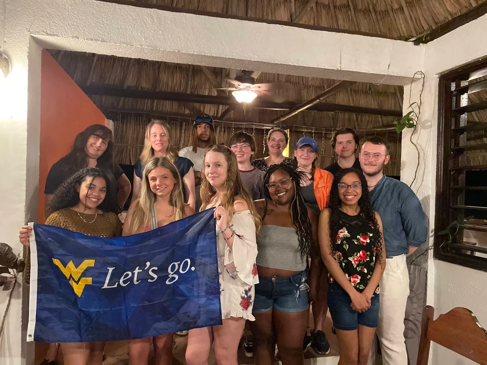 University group with their school flag in Belize