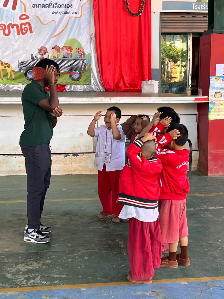 Students leading a health activity with Thai schoolchildren