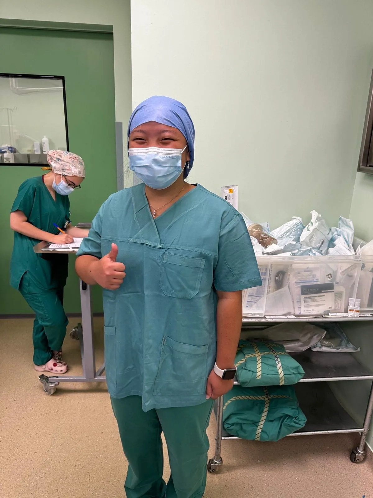 Student in scrubs during a hospital rotation in Athens