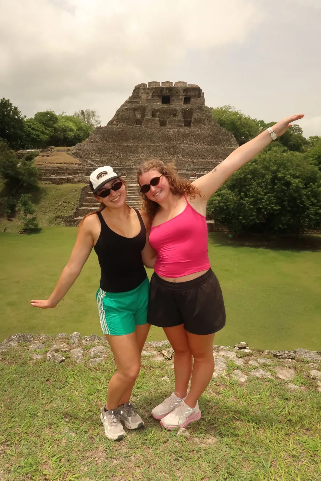 Two students celebrating at the Xunantunich Maya site in Belize