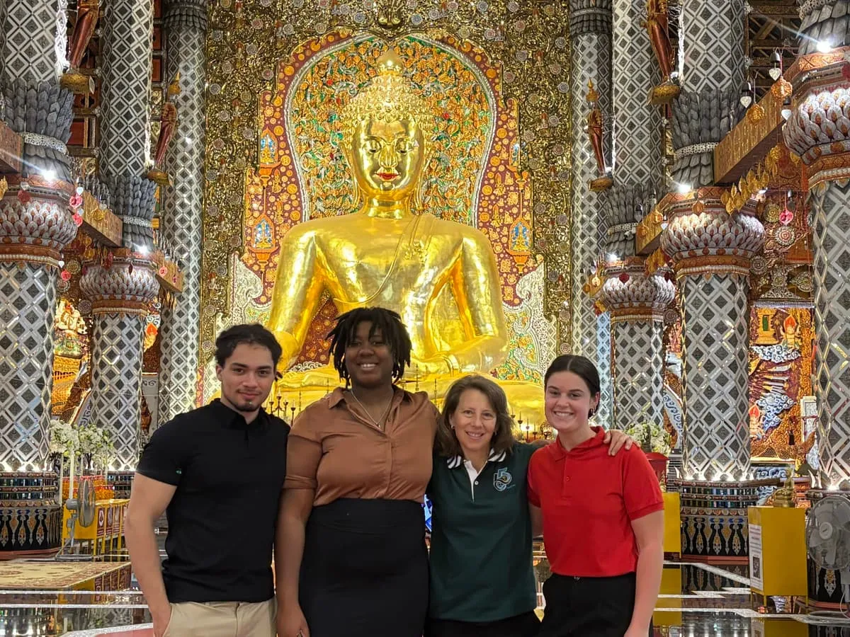 Students visiting a Buddhist temple in Thailand